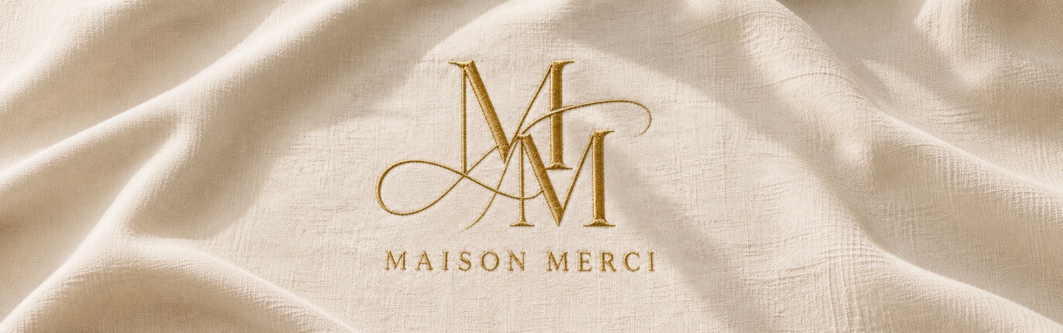 Maison Merci gold monogram embroidered on ivory fabric